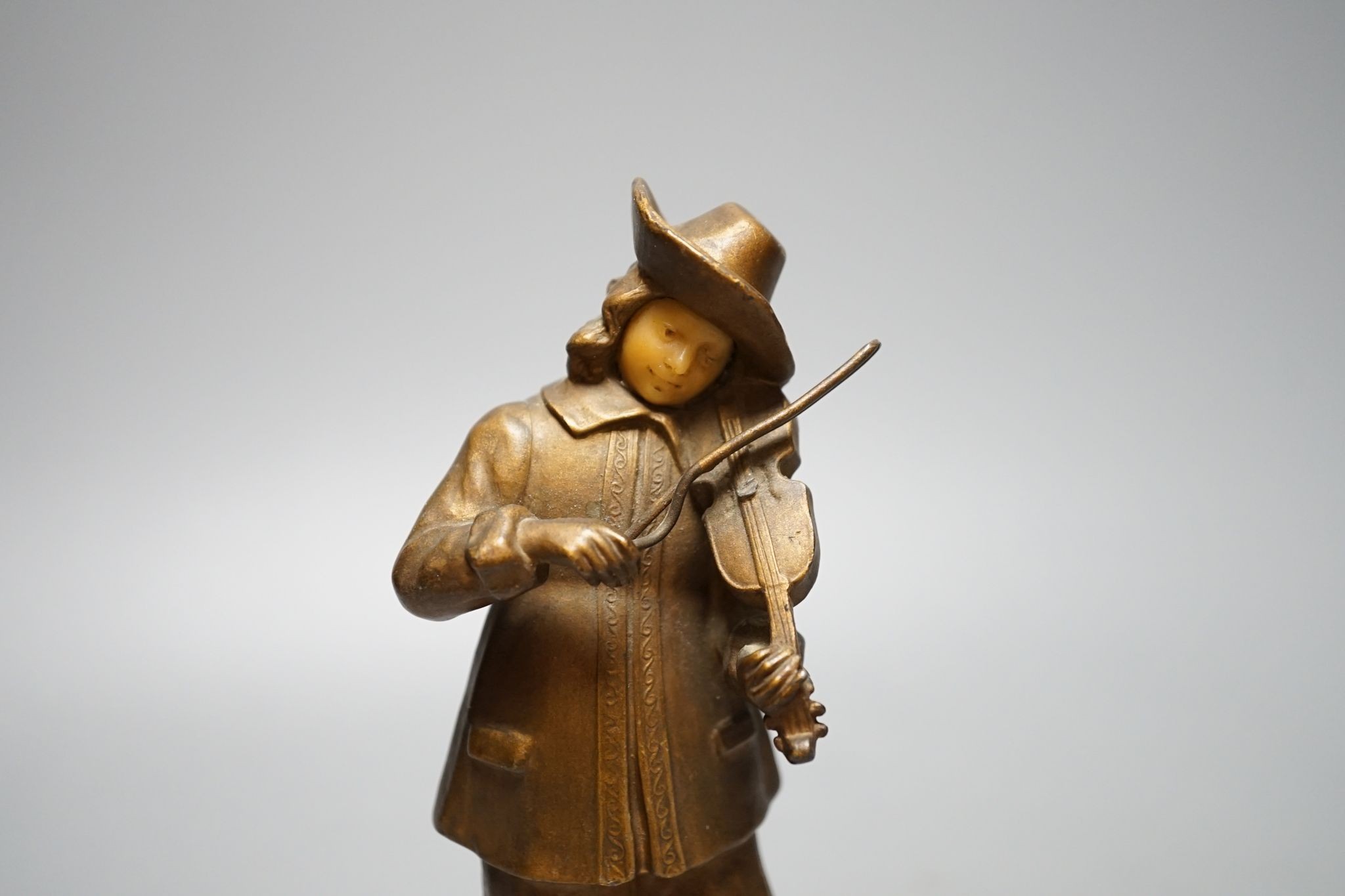 A pair of gilt spelter figures of magicians., 19 cms high.